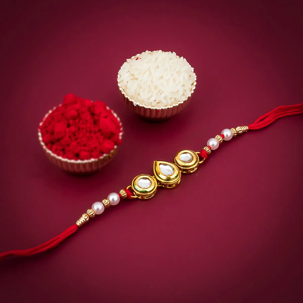 Sukkhi Astonish Gold Plated Kundan Rakhi for Brother with Roli Chawal and Raksha Bandhan Greeting Card For Men